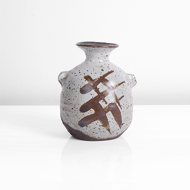 A creamy white and iron stoneware bottle with lugs made by Janet Leach sold at auction by Maak Contemporary Ceramics