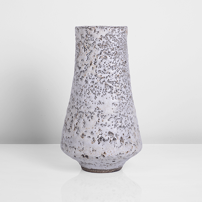 A pitted white stoneware vase made by Lucie Rie in circa 1965 sold at auction by Maak Contemporary Ceramics