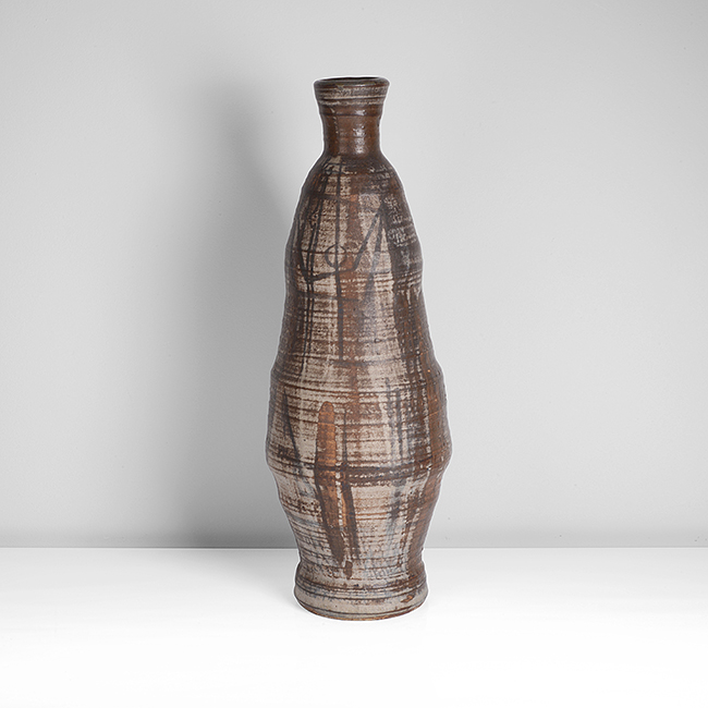 An iron and grey stoneware tall vessel made by Robert J Washington sold at auction by Maak