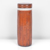 An orange raku tall lidded vessel made by Inger Rokkjaer in 2005 sold at auction by Maak Contemporary Ceramics
