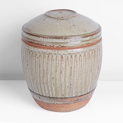 A green stoneware lidded jar made by Richard Batterham sold at auction by Maak Contemporary Ceramics