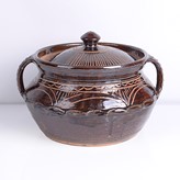 A brown stoneware casserole made by Michael Cardew in circa 1975 sold at auction by Maak Contemporary Ceramics