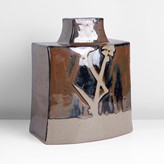 A persimmon stoneware curved bottle made by Hamada Shoji sold at auction by Maak Contemporary Ceramics