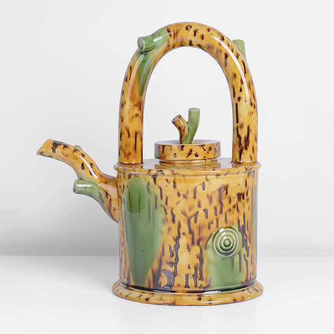 A yellow, brown and green earthenware teapot made by Walter Keeler in 1999 sold at auction by Maak Contemporary Ceramics