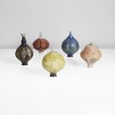 Five porcelain sea pod vessels made by Geoffrey Swindell sold at auction by Maak Contemporary Ceramics