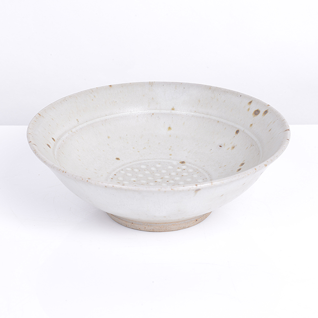 A pale grey stoneware bowl made by Gwyn Hanssen Pigott in circa 1975 sold at auction by Maak Contemporary Ceramics