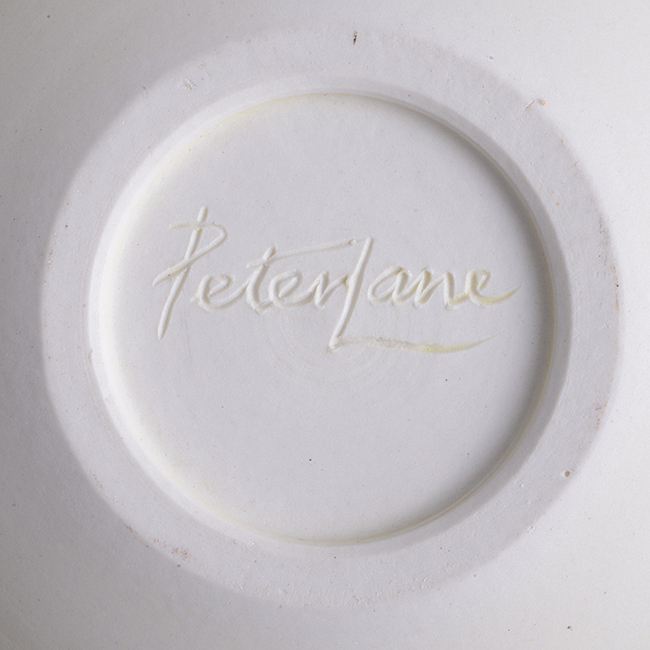 An incised signature by Peter Lane on a porcelain bowl