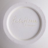 An incised signature by Peter Lane on a porcelain bowl