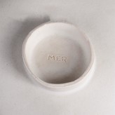 An incised MER mark on a bowl made by Mary Rogers