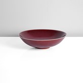 A copper red stoneware bowl made by Rupert Spira in circa 2003 sold at auction by Maak Contemporary Ceramics