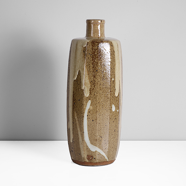 A brown stoneware bottle vase made by William Marshall in circa 1990 sold at auction by Maak
