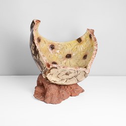 A yellow and brown earthenware 'Rudbeckia Dish' made by Carol McNicoll in 1999 sold at auction by Maak Contemporary Ceramics