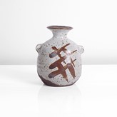 A creamy white and iron stoneware bottle with lugs made by Janet Leach sold at auction by Maak Contemporary Ceramics
